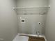 Laundry room hookups with laminate flooring and white trim at 186 Coharie Dr, Lillington, NC 27546