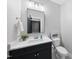 Updated bathroom featuring a vanity, white quartz countertop, faucet, toilet, and tile floors at 2040 Pleasant Forest Way, Wake Forest, NC 27587