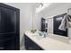 Modern bathroom with a vanity, undermount sink, quartz countertop, and a dark blue painted door at 2040 Pleasant Forest Way, Wake Forest, NC 27587