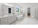 Luxurious primary bathroom with soaking tub, dual vanity and views into the closet at 2040 Pleasant Forest Way, Wake Forest, NC 27587