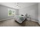 Comfortable bedroom features a ceiling fan, neutral walls, plush carpet, and a window with natural light at 2040 Pleasant Forest Way, Wake Forest, NC 27587
