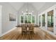 Bright dining room with vaulted ceiling, hardwood floors, and large windows with a backyard view at 2040 Pleasant Forest Way, Wake Forest, NC 27587