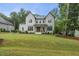 Beautiful new construction two-story home featuring a manicured lawn and a classic modern farmhouse design at 2040 Pleasant Forest Way, Wake Forest, NC 27587
