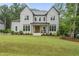 Charming front exterior showcasing a well-manicured lawn and a welcoming entrance at 2040 Pleasant Forest Way, Wake Forest, NC 27587