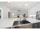 Kitchen featuring a large center island, white cabinets, stainless steel appliances, and open to living space at 2040 Pleasant Forest Way, Wake Forest, NC 27587
