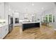 Kitchen featuring a large center island, stainless steel appliances, and lots of natural light at 2040 Pleasant Forest Way, Wake Forest, NC 27587