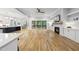 Open living area showcasing modern finishes, a fireplace, built-in shelving, and a seamless connection to the outdoor deck at 2040 Pleasant Forest Way, Wake Forest, NC 27587