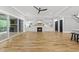 Bright living room with large sliding glass doors, built-in shelving, fireplace, and hardwood floors throughout at 2040 Pleasant Forest Way, Wake Forest, NC 27587