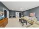 Spacious living room offers a ceiling fan, a window, plush seating, neutral walls, and plush carpet at 2040 Pleasant Forest Way, Wake Forest, NC 27587