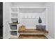 Mudroom with built-in bench seating, open storage and coat hooks at 2040 Pleasant Forest Way, Wake Forest, NC 27587