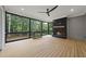 Cozy screened porch features a fireplace, ceiling fan, wood flooring, and scenic views at 2040 Pleasant Forest Way, Wake Forest, NC 27587