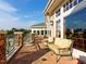 Inviting brick patio with comfortable seating offers scenic views of the surrounding landscape and blue skies above at 207 Callum Pl, Cary, NC 27519