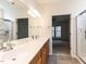 Spacious bathroom with double sinks, tiled floors, and a shower and bedroom visible at 207 Callum Pl, Cary, NC 27519