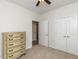 Carpeted bedroom with large closet, dresser, and doorway to another room at 207 Callum Pl, Cary, NC 27519