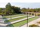 Well-manicured bocce ball courts, accented by decorative lighting, offer a tranquil setting for outdoor recreation at 207 Callum Pl, Cary, NC 27519