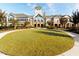 Beautiful community building with manicured lawn, water feature, and classic architecture at 207 Callum Pl, Cary, NC 27519