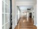 View of the foyer featuring hardwood floors, white walls, and a dining area and Gathering room at 207 Callum Pl, Cary, NC 27519