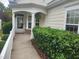 Charming front porch with a covered entrance, decorative plants, and welcoming curb appeal at 207 Callum Pl, Cary, NC 27519