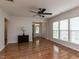 View of living room with hardwood floors, natural light, and a classic cabinet near the entrance at 207 Callum Pl, Cary, NC 27519