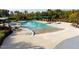 Resort-style outdoor pool boasts ample lounge chairs, sunshades, and lush landscaping for relaxation and recreation at 207 Callum Pl, Cary, NC 27519