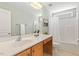 Bathroom with a vanity and sink, a mirror, and shower with tub and curtain at 2128 Feather Ridge Dr, Holly Springs, NC 27540