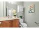 Charming powder room featuring a stylish vanity, decorative mirror, and elegant fixtures at 2128 Feather Ridge Dr, Holly Springs, NC 27540