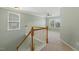 Upstairs landing bathed in natural light offering views and leading to bedrooms at 2128 Feather Ridge Dr, Holly Springs, NC 27540