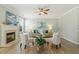 Bright living room features hardwood floors, a fireplace, and comfortable seating arrangements at 2128 Feather Ridge Dr, Holly Springs, NC 27540
