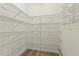 Walk-in pantry provides generous storage space with organized wire shelving at 2128 Feather Ridge Dr, Holly Springs, NC 27540
