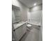 Bathroom features a granite vanity top and a shower-tub combo at 217 Busterfield Ct, Benson, NC 27504