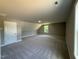 Large, carpeted bedroom with neutral walls and natural light from the window at 217 Busterfield Ct, Benson, NC 27504