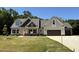 Charming two-story home with a well-manicured lawn and a two-car garage at 217 Busterfield Ct, Benson, NC 27504