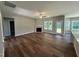 Spacious living room featuring a fireplace, hardwood floors, and natural light at 217 Busterfield Ct, Benson, NC 27504