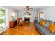 Cozy living room featuring hardwood floors, a fireplace, and a comfortable seating area for relaxation at 2417 Ridgeford Ct, Fuquay Varina, NC 27526