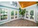Bright sunroom with tile flooring, a vaulted wood ceiling, and plenty of windows and glass doors at 2417 Ridgeford Ct, Fuquay Varina, NC 27526