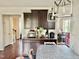 Well-lit kitchen featuring granite counters, stainless appliances, and hardwood floors at 2511 Kestrel Heights Ct Ct, Durham, NC 27703