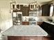 Modern kitchen featuring a center island, stainless steel appliances, and sleek white subway tile at 2511 Kestrel Heights Ct Ct, Durham, NC 27703