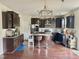 Spacious kitchen with dark cabinets, a center island, and stainless steel appliances at 2511 Kestrel Heights Ct Ct, Durham, NC 27703