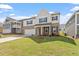 Charming two-story home with a well-manicured lawn, brick facade, and a welcoming front porch at 257 North Maple Walk Dr # 218, Garner, NC 27529