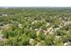 Expansive aerial view of a neighborhood with lush greenery and mature trees, showcasing a serene and residential community at 2608 York Rd, Raleigh, NC 27608
