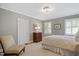 Cozy bedroom with a neutral color scheme, comfortable bed, and ample natural light at 2608 York Rd, Raleigh, NC 27608
