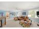 Bonus room with light blue walls, neutral carpet, a ceiling fan, and large windows with plantation shutters at 2608 York Rd, Raleigh, NC 27608