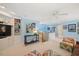 Bonus room with light blue walls, neutral carpet, a ceiling fan, and built-in shelving and cabinets at 2608 York Rd, Raleigh, NC 27608