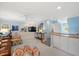Bonus room with light blue walls, neutral carpet, a ceiling fan, and a large flatscreen television at 2608 York Rd, Raleigh, NC 27608