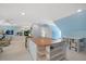 Bonus room with light blue walls, neutral carpet, and a bar with white shelving and a wood countertop at 2608 York Rd, Raleigh, NC 27608