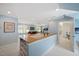 Bonus room with light blue walls, neutral carpet, and a bar with white shelving and a wood countertop at 2608 York Rd, Raleigh, NC 27608