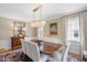 Bright dining room with modern chandelier, elegant furnishings, and neutral décor at 2608 York Rd, Raleigh, NC 27608