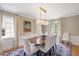Bright formal dining room featuring hardwood floors and classic white furnishings at 2608 York Rd, Raleigh, NC 27608