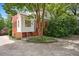 Charming home featuring brick and white siding with well-manicured landscaping at 2608 York Rd, Raleigh, NC 27608