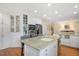 Bright kitchen with granite counters, stainless steel appliances, and custom cabinetry at 2608 York Rd, Raleigh, NC 27608